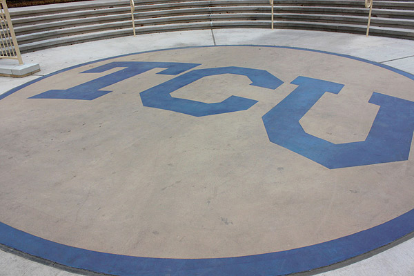 Polished colored concrete TCU logo apartment building