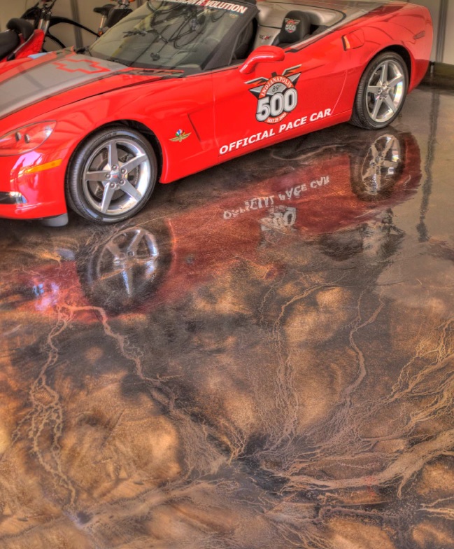 An Orange And Brown High Sheen Acid Stained Concrete Garage