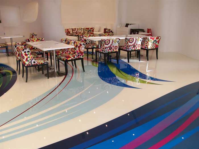 Installers applied large, colorful decals to the floors of the BoHouse Café to complement the restaurant's whimsical déco, of which these floral patterned chairs are just one example.