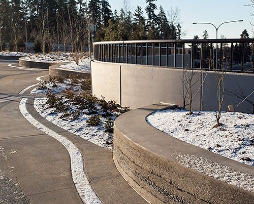 Over 5,000 Square Feet, and it's not difficult to see why. Entering or exiting the bridge, drivers navigate around a custom-colored, stamped concrete roundabout that directs the flow of traffic. 