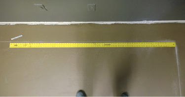 Use a 6-foot straight edge to measure 6 feet out in both directions from the corner.