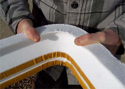 Using fiberglass tape, a polystyrene foam form can be bent into a curve with a smooth, tight radius that maintains the profile with minimum distortion.