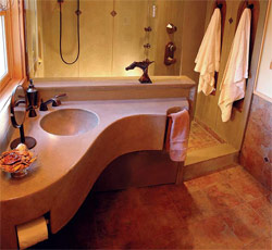 Decorative Concrete Pioneers show off his skills with this curved concrete sink in bathroom.