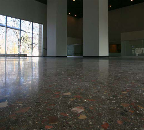 The facility floor is textured with stones, some as large as an inch and a half in diameter, all brought to life with a grind and polish process