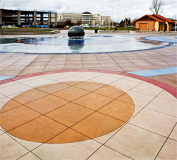 Circular lines created with concrete coloring techniques in this outdoor meeting space.