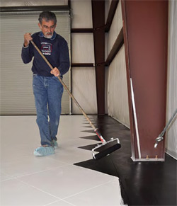 Julio Hallack applies the concrete color produced by Miracote.