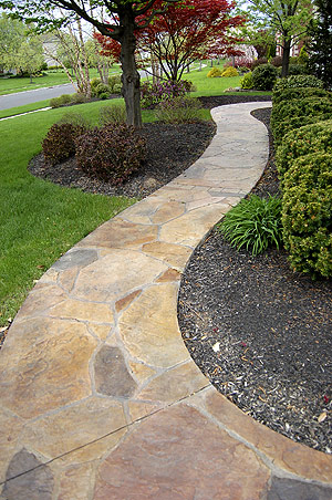 Stone rock-like pathway made with stamped concrete and concrete stain