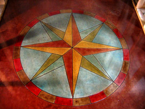 A yellow and red compass rose on a blue and red background.