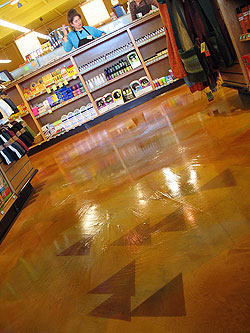 The New Leaf Market in Half Moon Bay, Calif., has a floor created using a two-pass Magic-troweled Sgraffino overlay and dyed graphics. Photo courtesy of The Concretist.