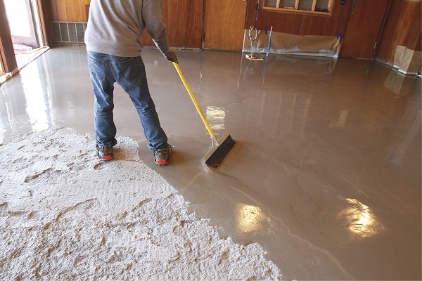 concrete - Can I pour self leveling cement over this carpet glue