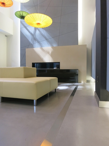 Polished concrete floor with a modern sofa.