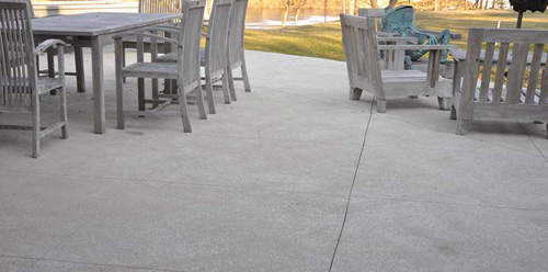 Use concrete to get the luxurious look of travertine tile.