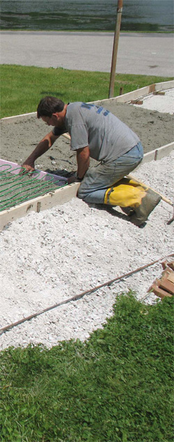 Hydronic heating systems are best suited for large areas. To install them, workers embed specialized tubing in a concrete slab or in a thin concrete mixture over an existing subfloor.