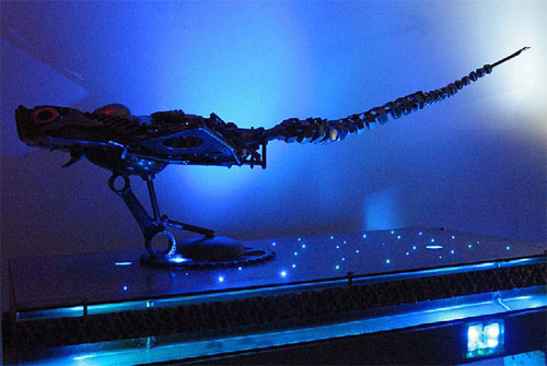 Fiber optics on this countertop illuminate the skeleton of the dinosaur on it.
