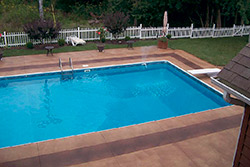 Pool deck colored with Stone Essence stain.