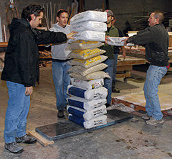 A scrim-augmented GFRC beam bearing a load of 835 pounds.