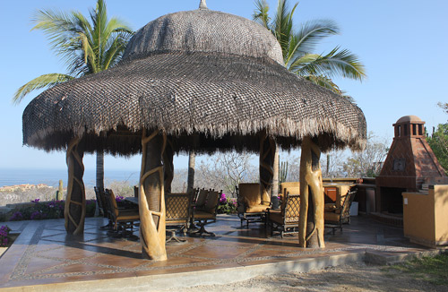 Palapa roof over concrete kitchen in Los Cabos Mexico.