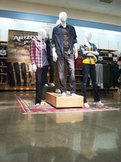 Unlike the high-tech look at Levis, The Original Arizona Jeans Co. shop has a more rustic feel, even though both shops feature the same polished gray concrete floors. This shop is in Lafayette, Ind.
