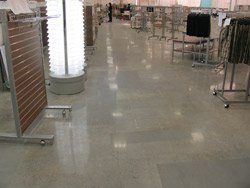 As seasoned contractors would expect, some of the polished floors in renovated stores contain irregularities like the patched sections seen here. Photo courtesy of S&S Concrete Floors Inc.