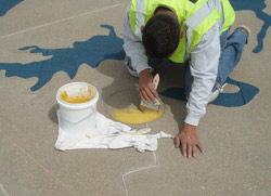 Memorializing 9/11 with an Engraved Concrete Map From there, the crew cut the state lines with V-cuts and taped down plastic. With the water area and shoreline exposed, they installed a blue Micro-Top finish to simulate the Atlantic Ocean and lakes.