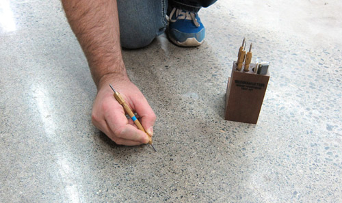 A Mohs hardness test kit from WerkMaster contains four picks. The picks are color-coded to link them with regions on a map of the United States showing the typical hardness of concrete in each area. Also included in the kit are a sharpening tool and three test plates to help contractors master scratching technique. Photos courtesy of WerkMaster