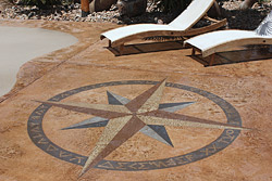 Payette used a compass to align the compass rose directionally and used stencils for the letters depicting direction, dremeling the edges to get a rough appearance. The rest he did freehand with a dremel, a truss strap and a framing square.