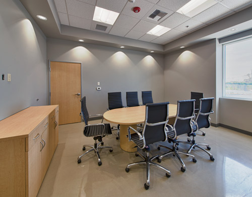 The conference room features Ardex PC-T Polished Concrete Topping.