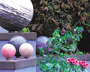 Carole Vincent and garden concrete balls of many colors.